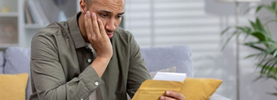 a man looking at his online loan approval mistakes