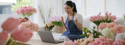 good lender; a woman happy after getting a loan