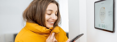 A lady looking at her phone smiling