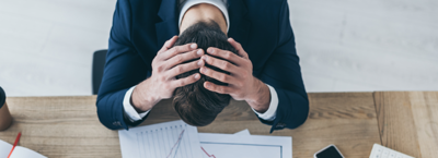 man stressed budgeting during job change