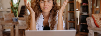 Women stressed at laptop