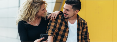 How to Make More Money in Your Current Job; couple looking at phone