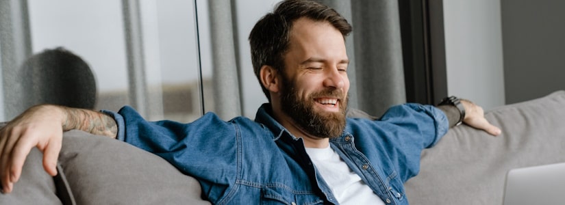 man relaxing on sofa due to easy loan timeline