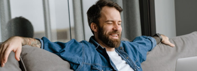 man relaxing on sofa due to easy loan timeline