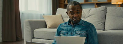 man looking at lower energy bills