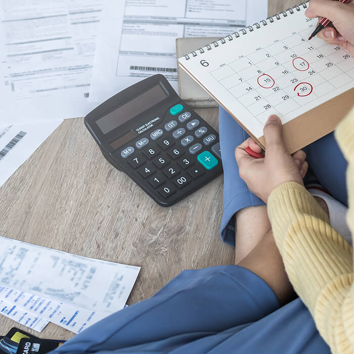 Women studies finances using calculator
